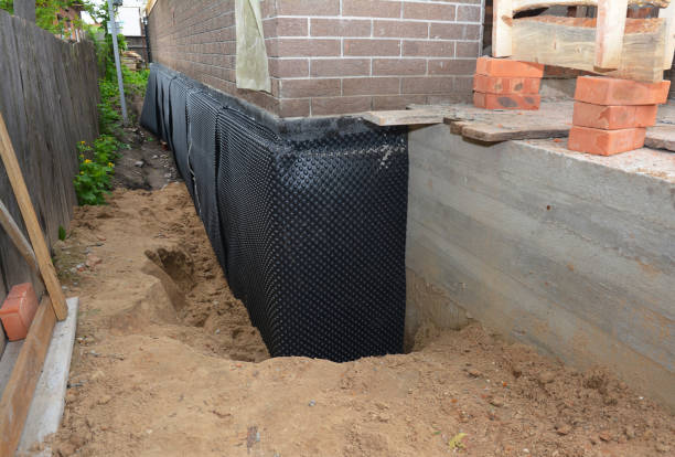 Happy homeowners after waterproofing job in Great Neck